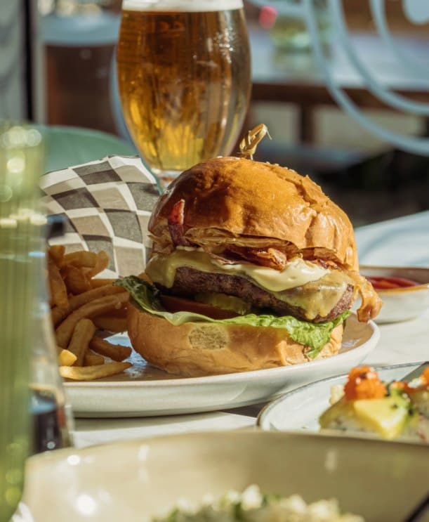 The GM burger with hand-cut fries and a cold beer